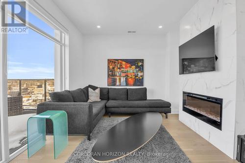 1105 - 71 Wyndham Street S, Guelph, ON - Indoor Photo Showing Living Room With Fireplace