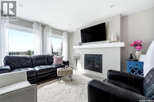 8849 Kestral Drive, Regina, SK - Indoor Photo Showing Living Room With Fireplace