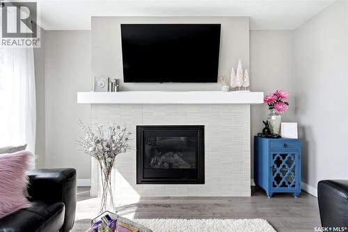 8849 Kestral Drive, Regina, SK - Indoor Photo Showing Living Room With Fireplace
