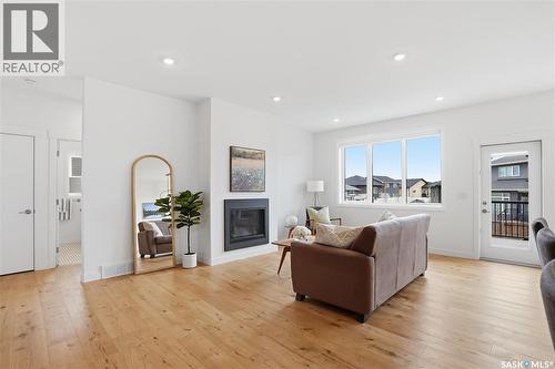 330 Hamm Way, Saskatoon, SK - Indoor Photo Showing Living Room With Fireplace