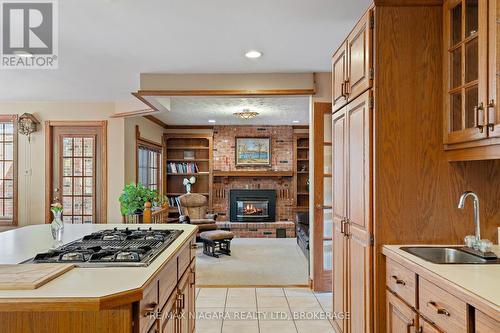 3908 Carolynn Court, Lincoln (Lincoln-Jordan/Vineland), ON - Indoor Photo Showing Kitchen With Fireplace