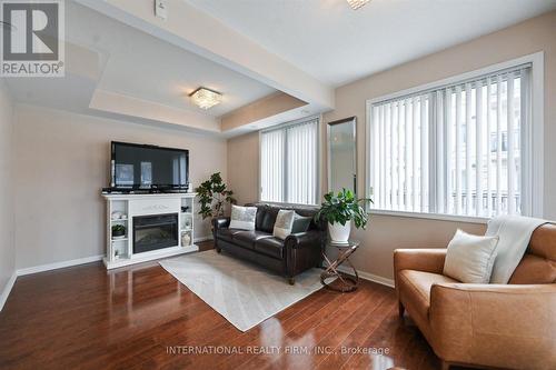 111 - 3075 Thomas Street, Mississauga, ON - Indoor Photo Showing Living Room With Fireplace