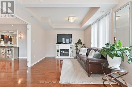 111 - 3075 Thomas Street, Mississauga, ON - Indoor Photo Showing Living Room With Fireplace