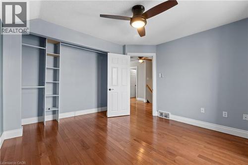 Bedroom featuring wood-finish flooring and light blue walls - 204 Beach Boulevard, Hamilton, ON - Indoor Photo Showing Other Room