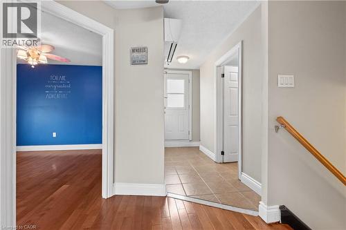 Entryway featuring tile flooring, a white door with window panes, and light gray walls - 204 Beach Boulevard, Hamilton, ON - Indoor Photo Showing Other Room