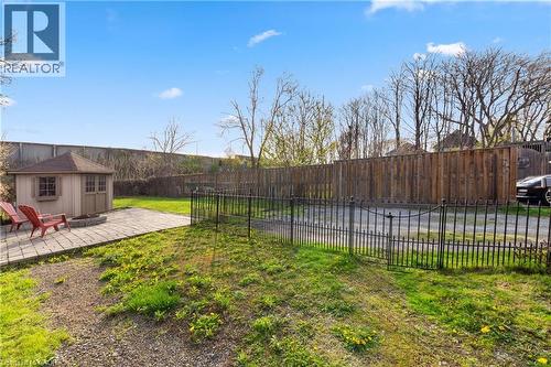Expansive yard featuring a paver patio with a built-in fire pit - 204 Beach Boulevard, Hamilton, ON - Outdoor