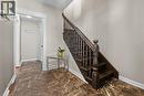 Staircase with dark wood newel post and balusters, featuring carved detailing - 204 Beach Boulevard, Hamilton, ON  - Indoor Photo Showing Other Room 