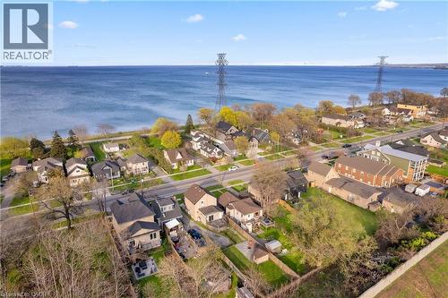 Waterfront community featuring residential properties, mature trees, and a paved road - 204 Beach Boulevard, Hamilton, ON - Outdoor With Body Of Water With View