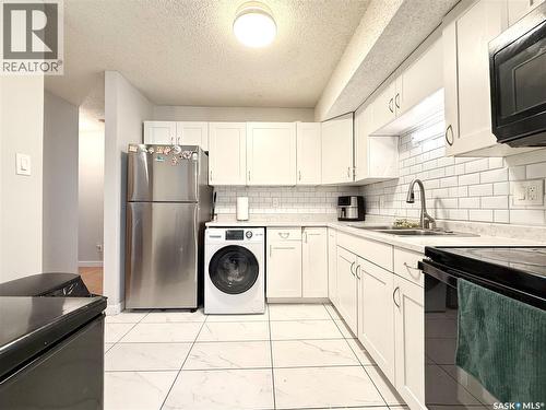 101 335 Kingsmere Boulevard, Saskatoon, SK - Indoor Photo Showing Kitchen With Double Sink