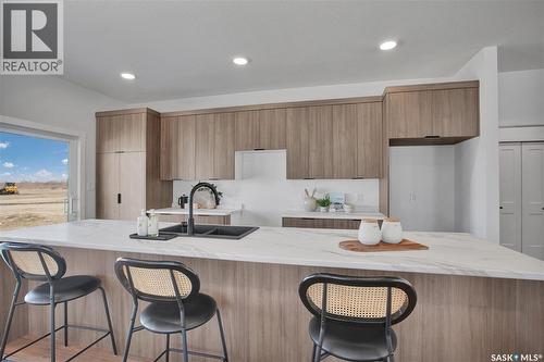 101 Emma Crescent, Martensville, SK - Indoor Photo Showing Kitchen With Double Sink With Upgraded Kitchen