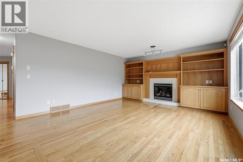 9382 Wascana Mews, Regina, SK - Indoor Photo Showing Living Room With Fireplace
