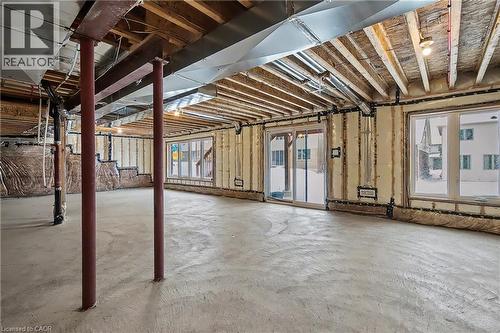Unfinished lower level featuring exposed joists, concrete flooring, and spray foam insulation - 123 Rea Drive, Fergus, ON - Indoor