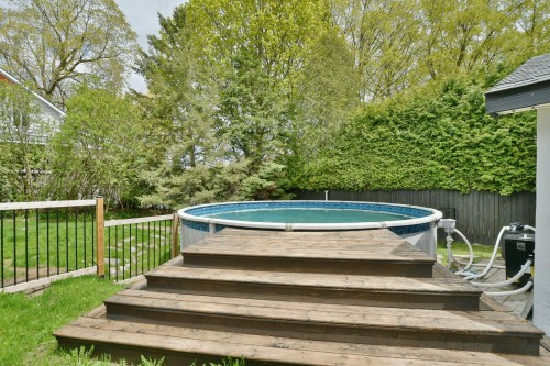 Cour - 574  - A Ch. Du Bois, Laval (Sainte-Dorothée), QC - Outdoor With Above Ground Pool With Backyard