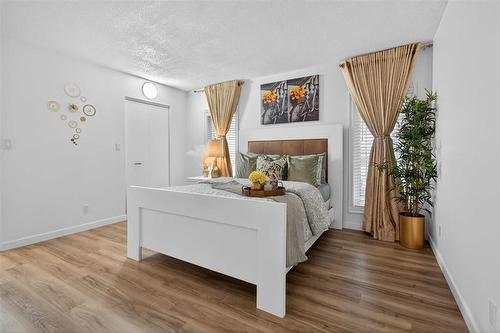 23 Hyatt Place, Winnipeg, MB - Indoor Photo Showing Bedroom With Fireplace