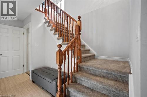 Carpeted staircase featuring wooden banisters and spindle railing - 30 Heatherwood Place, Kitchener, ON - Indoor Photo Showing Other Room