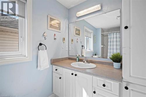 White vanity with an integrated sink and gray countertop - 30 Heatherwood Place, Kitchener, ON - Indoor Photo Showing Bathroom