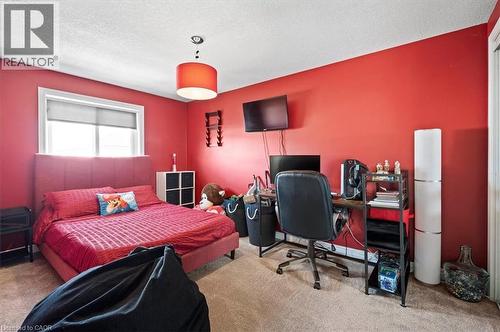 Interior room featuring red painted walls and light-colored carpeting - 30 Heatherwood Place, Kitchener, ON - Indoor Photo Showing Bedroom