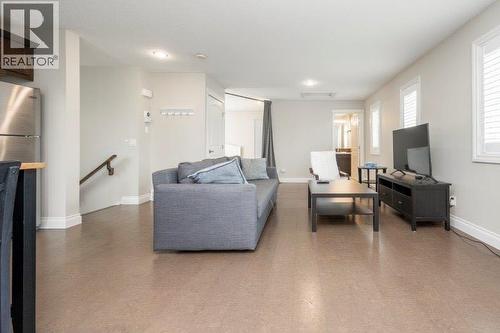 Carriage House - 1 Murmansk Way Sw, Calgary, AB - Indoor Photo Showing Living Room