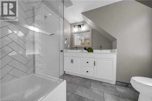 Bathroom featuring a dual vanity with white cabinetry and black hardware - 26 Peachtree Crescent, Cambridge, ON - Indoor Photo Showing Bathroom