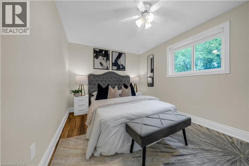 Bedroom featuring wood-finish flooring, neutral wall tones, and crown molding - 26 Peachtree Crescent, Cambridge, ON - Indoor Photo Showing Bedroom