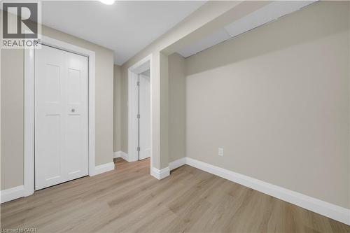 Interior space featuring light wood-finish flooring, neutral-toned walls, and white trim - 26 Peachtree Crescent, Cambridge, ON - Indoor Photo Showing Other Room