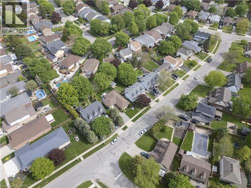 Aerial perspective showcasing a residential neighborhood with numerous single-family homes - 26 Peachtree Crescent, Cambridge, ON -  With View