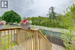 Wooden deck railing with vertical balusters - 