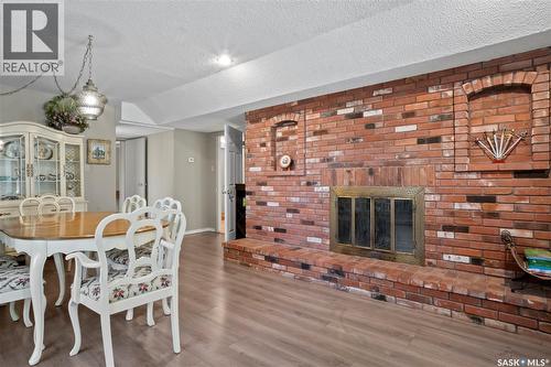 66 Leslie Place, Regina, SK - Indoor Photo Showing Dining Room With Fireplace