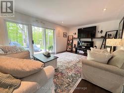 Living Room with Walk-Out to Expansive Deck - 