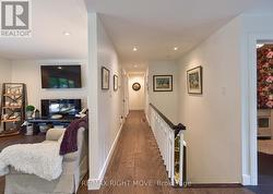 Hallway to Bedrooms and Front Stairs to Basement - 