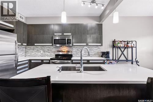 934 Stonebridge Common, Saskatoon, SK - Indoor Photo Showing Kitchen With Double Sink With Upgraded Kitchen
