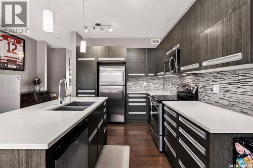 934 Stonebridge Common, Saskatoon, SK - Indoor Photo Showing Kitchen With Double Sink With Upgraded Kitchen