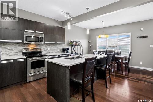 934 Stonebridge Common, Saskatoon, SK - Indoor Photo Showing Kitchen With Double Sink With Upgraded Kitchen