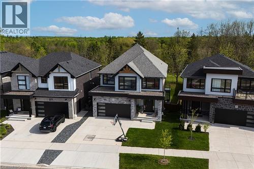 Modern residential property featuring a stone and siding exterior - 581 Doonwoods Crescent, Kitchener, ON - Outdoor With Facade