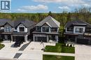 Modern residential property featuring a stone and siding exterior - 581 Doonwoods Crescent, Kitchener, ON  - Outdoor With Facade 
