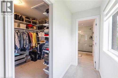 Dedicated walk-in closet featuring white shelving and hanging rods - 581 Doonwoods Crescent, Kitchener, ON - Indoor Photo Showing Other Room