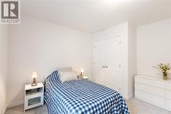 Bright room with light-toned walls and plush carpeting - 