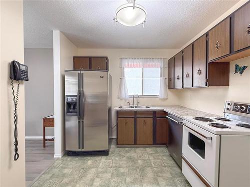 8 Macleod Drive, Brandon, MB - Indoor Photo Showing Kitchen With Double Sink