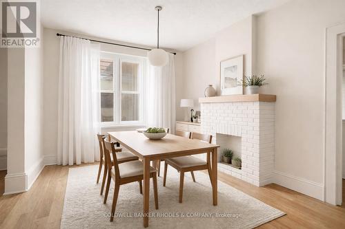 Digitally enhanced and staged - 1758 Scott Street, Ottawa, ON - Indoor Photo Showing Dining Room With Fireplace