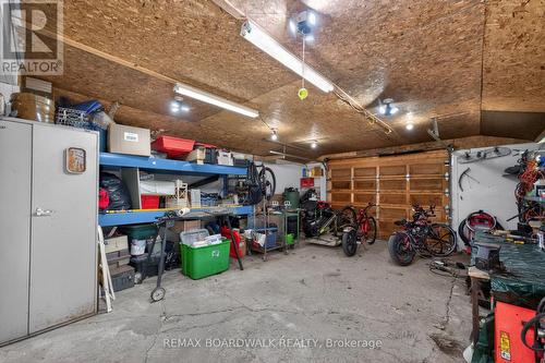 Oversized Detached Garage (16'10 x 31'9) - 92 Orvigale Road, Ottawa, ON - Indoor Photo Showing Garage