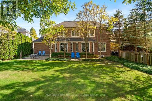 Fully Fenced Backyard Surrounded by Mature Trees - 562 Gladwyne Court, Mississauga, ON - Outdoor With Backyard