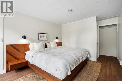 Bedroom featuring wood-finish flooring and light-toned walls - 6295 Guelph Line, Burlington, ON - Indoor Photo Showing Bedroom