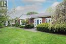 Brick exterior featuring white trim accents, a prominent front entry with sidelights, and a pitched roofline - 2023 Coronation Boulevard, Cambridge, ON  - Outdoor 