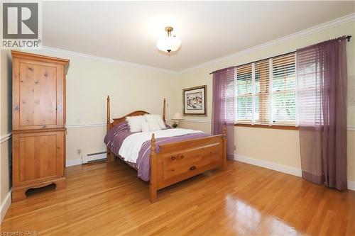 Hardwood flooring throughout, featuring a chair rail and crown molding - 2023 Coronation Boulevard, Cambridge, ON - Indoor Photo Showing Bedroom