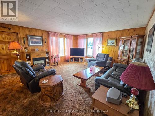 69 Main Street, Timiskaming (Tim - Latchford), ON - Indoor Photo Showing Living Room With Fireplace