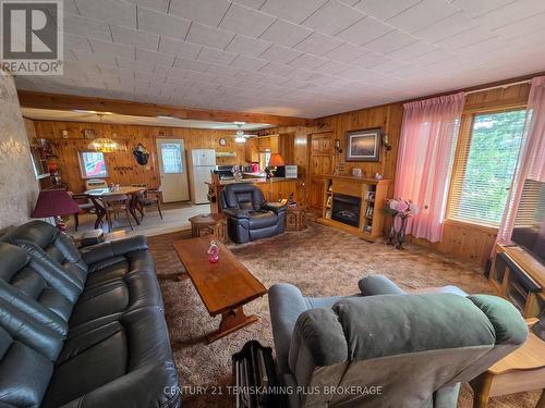 69 Main Street, Timiskaming (Tim - Latchford), ON - Indoor Photo Showing Living Room With Fireplace