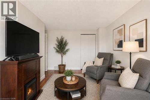 Virtually Staged - 144 Bellingham Drive, Hamilton, ON - Indoor Photo Showing Living Room With Fireplace