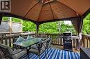 Spacious outdoor deck featuring a gazebo with a brown canopy, wooden railing, and a lattice privacy screen - 12 Karalee Crescent, Cambridge, ON  - Outdoor With Deck Patio Veranda With Exterior 