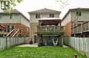 Rear exterior featuring a two-story wood deck with an integrated patio cover, a lower-level concrete patio, and a grass lawn - 12 Karalee Crescent, Cambridge, ON  - Outdoor With Deck Patio Veranda With Exterior 