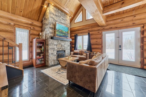 Living Room - 472 Ch. Champigny, Larouche, QC - Indoor Photo Showing Living Room With Fireplace